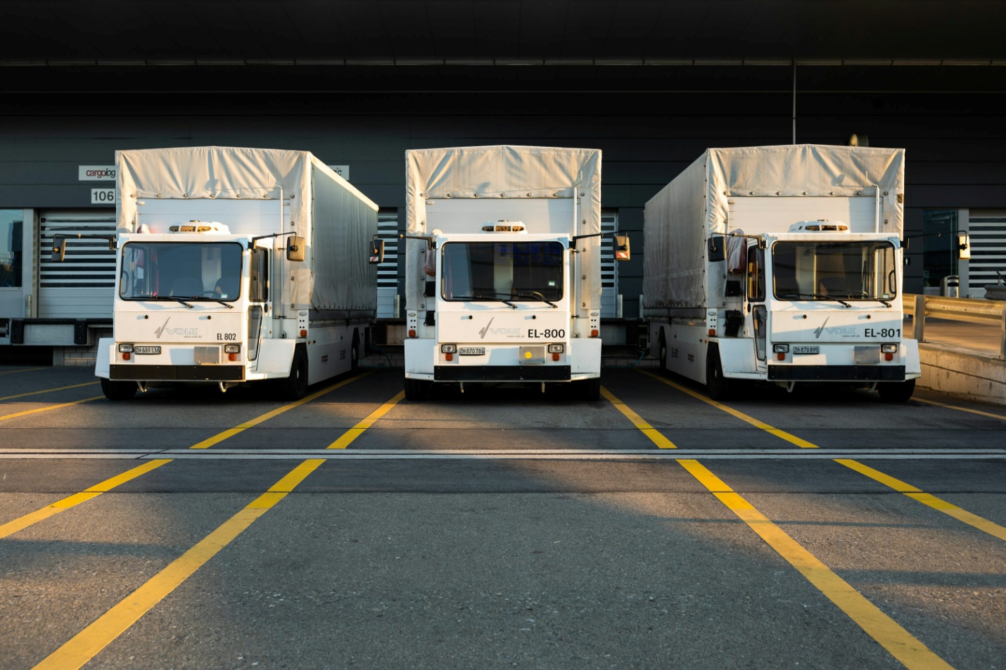 A fleet of white trucks