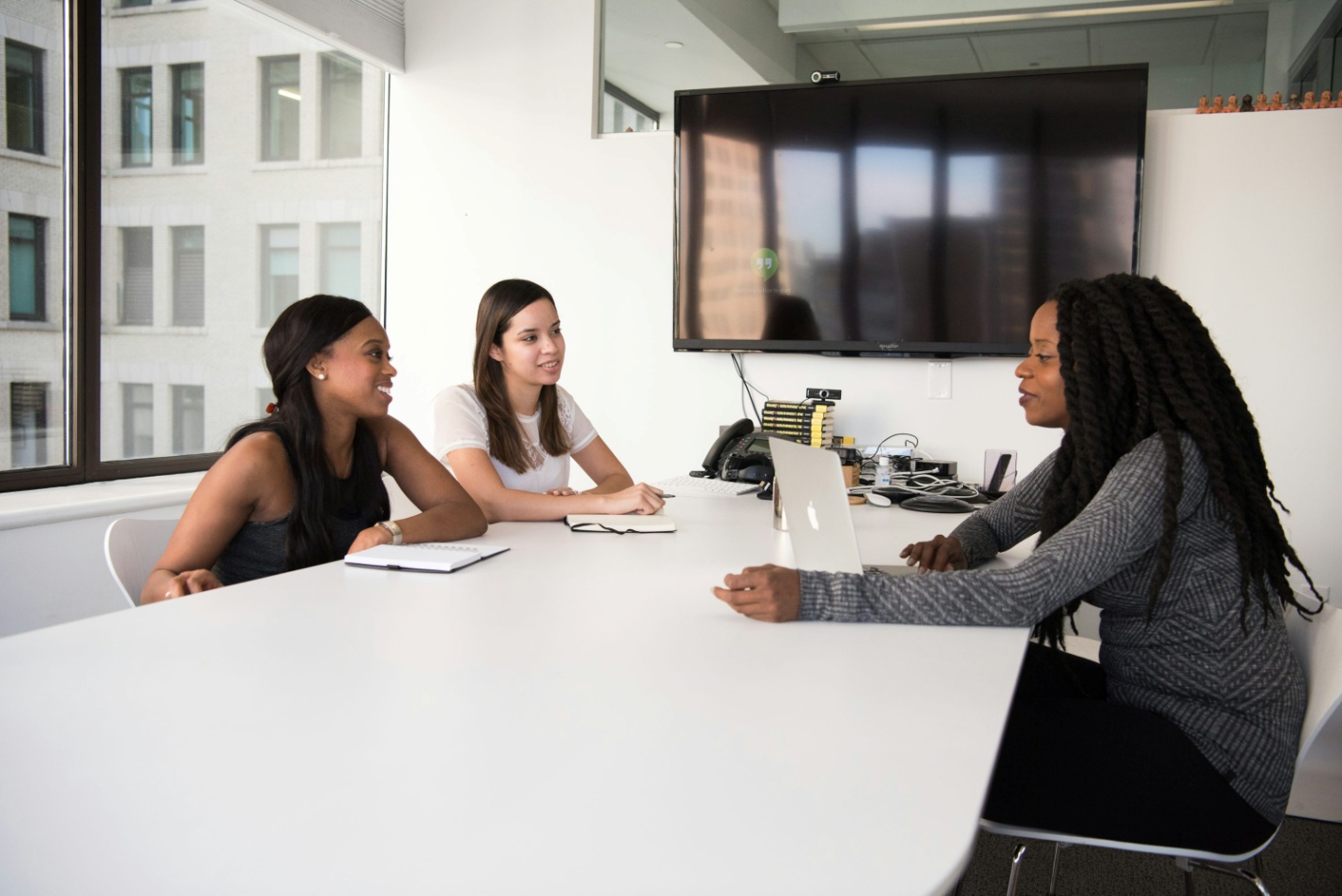 Three women at a meeting